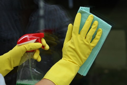 Professional cleaners cleaning a modern kitchen in Hcone London