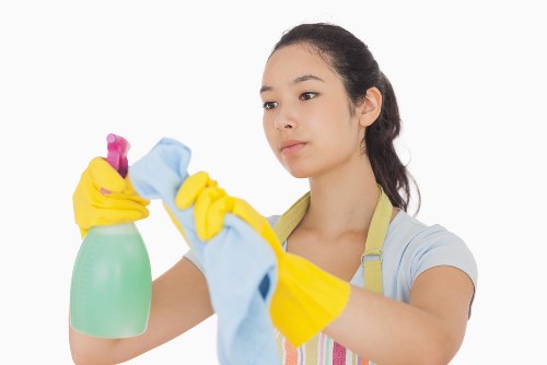 Technician performing patio cleaning with high-pressure equipment