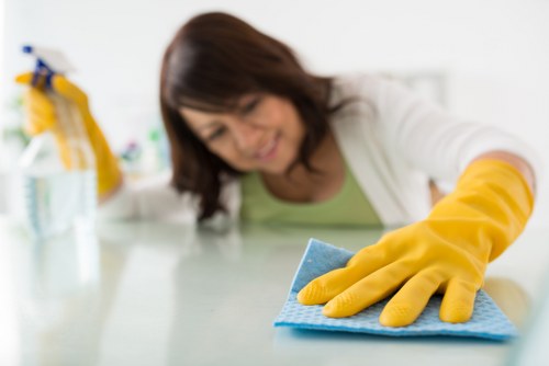 Professional cleaning hardwood floor with equipment